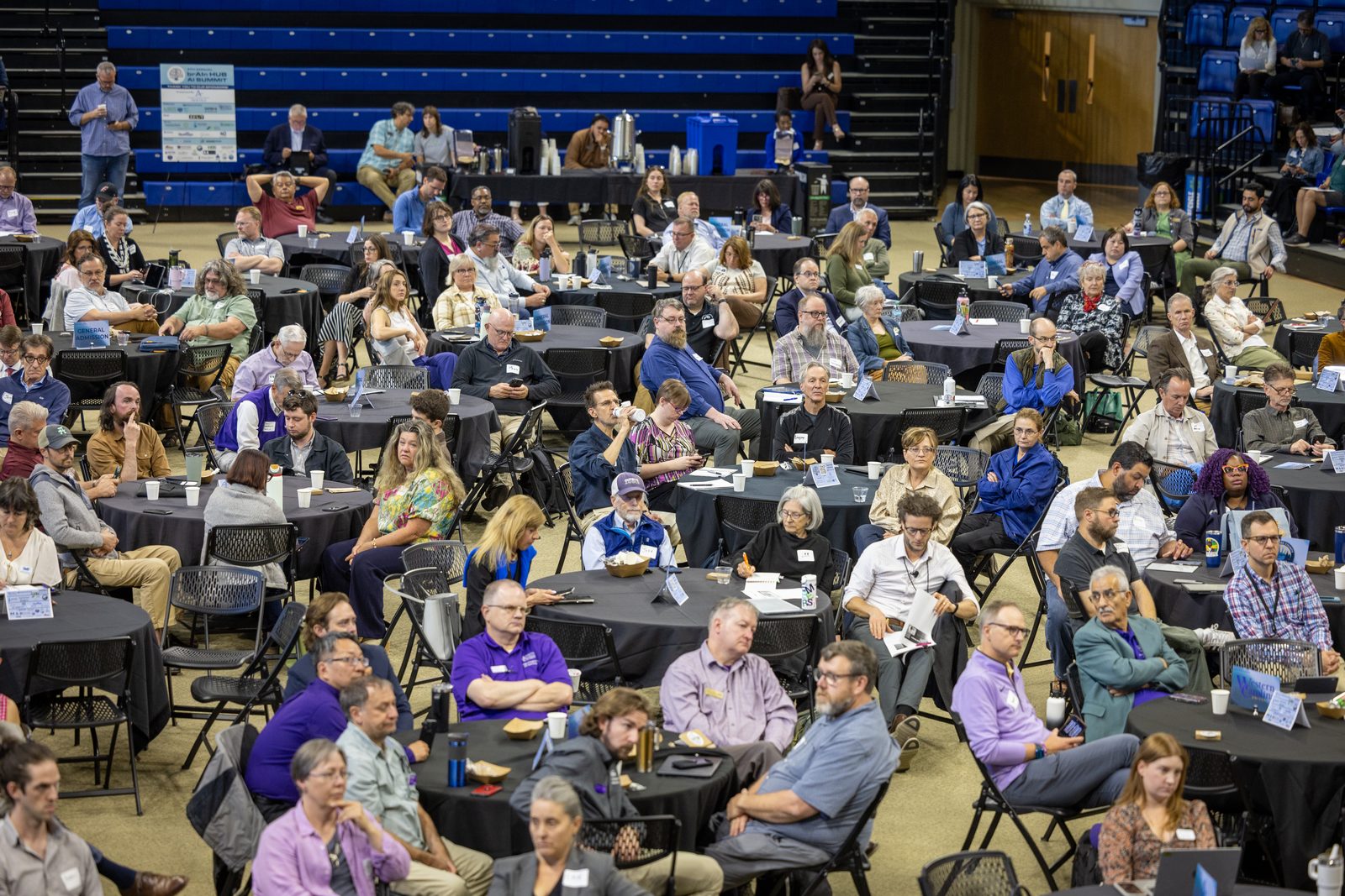 Elevated view of the Brainhub AI Summit with full round tables