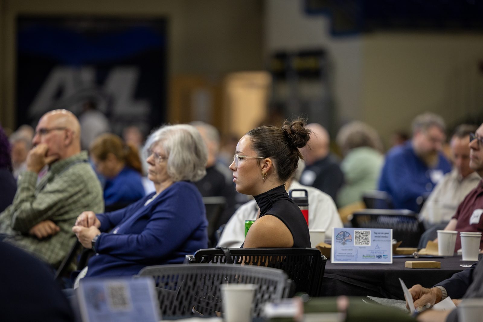 Educator listening at a Brainhub round table